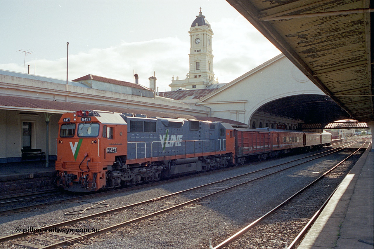 171-19
Ballarat station, clock tower, V/Line broad gauge N class N 457 'City of Mildura' Clyde Engineering EMD model JT22HC-2 serial 85-1225 with D van and N set sitting at platform with an Up passenger train.
Keywords: N-class;N457;Clyde-Engineering-Somerton-Victoria;EMD;JT22HC-2;85-1225;