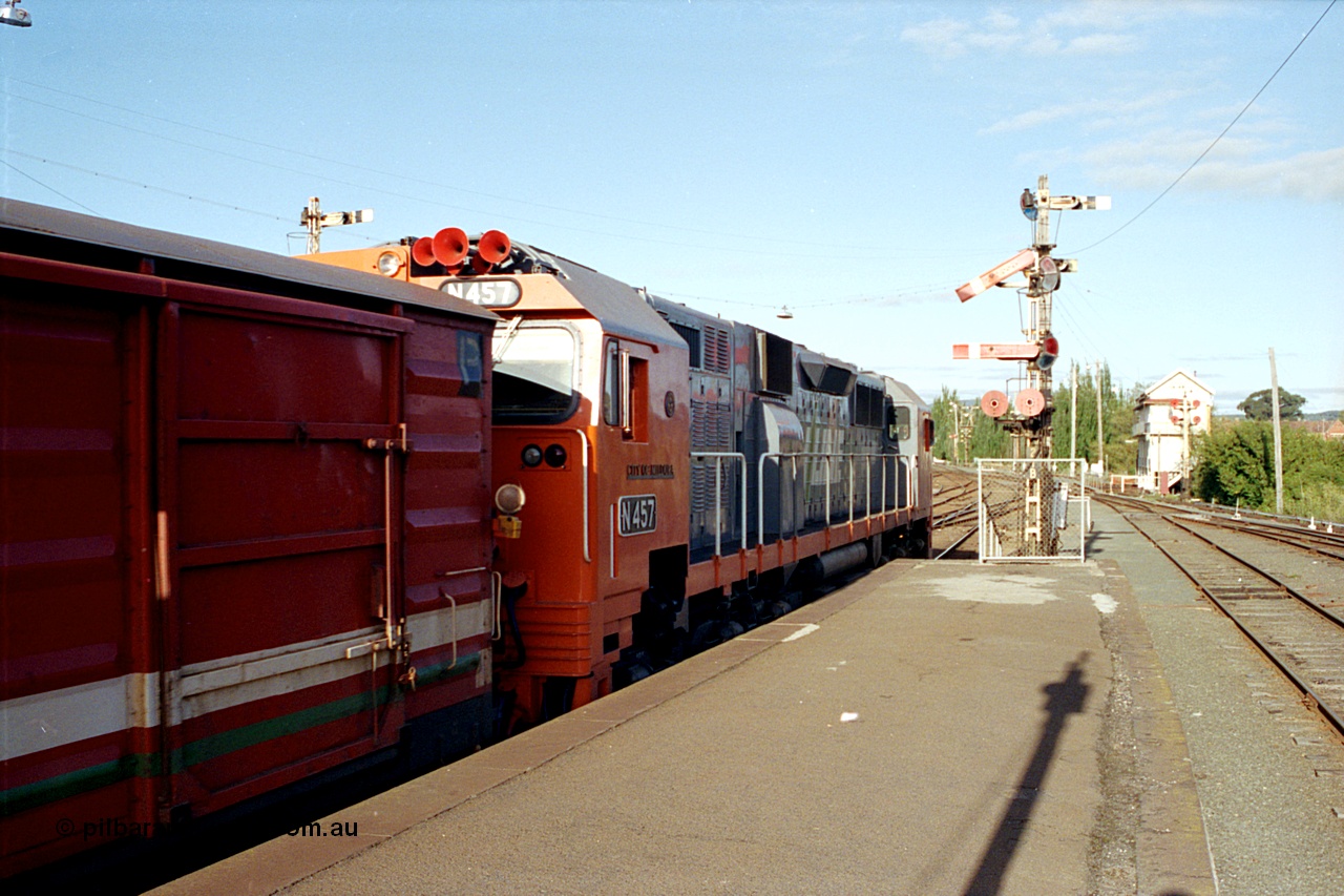 171-22
Ballarat station Platform 1, V/Line broad gauge N class N 457 'City of Mildura' Clyde Engineering EMD model JT22HC-2 serial 85-1225 departing with an Up pass, past signal Post 21B, Ballarat A Box at right of frame.
Keywords: N-class;N457;Clyde-Engineering-Somerton-Victoria;EMD;JT22HC-2;85-1225;