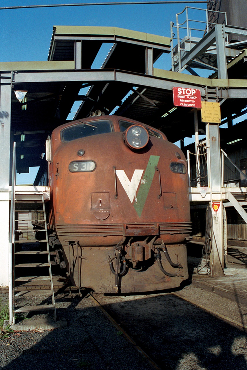 171-24
Ballarat East loco depot V/Line broad gauge S class S 312 'Peter Lalor' Clyde Engineering EMD model A7 serial 60-229 at the fuel point.
Keywords: S-class;S312;Clyde-Engineering-Granville-NSW;EMD;A7;60-229;bulldog;