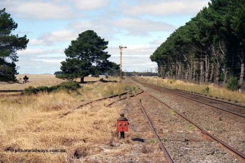 171-10
Trawalla station yard overview, looking towards Melbourne, end of No.3 Rd former stock yards would be directly left of this image, point indicator for catch points in grass, Down Home semaphore Signal Post 4 for moves from No.2A Road to No.2 Road.

