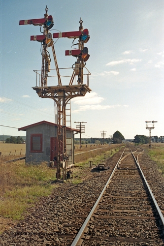 171-14
Trawalla station yard overview, looking towards Ararat, Down Home semaphore Signal Post 2 top arm on left hand Doll Home for Main Line to No. 1 Road to Post 5, bottom arm on left hand Doll Calling-on from Main Line to No.1 Road towards Post 5. Top arm on right hand Doll for Main Line to No. 2A Road to Post 4 and bottom Doll for Main Line to No. 2A Road towards Post 4. Motorised points, machine and electric interlocking room, semaphore Signal Post 3 facing up trains.
