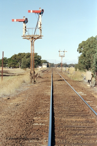 171-16
Buangor station yard overview, looking towards Melbourne, from up home semaphore signal Post 6, semaphore signal Post 5 facing down trains, signal box in the distance.
