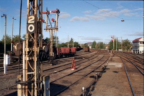 171-21
Ballarat station yard overview, A signal box on right, looking towards Melbourne, semaphore signals and discs, yard about to be rationalised and electric colour light signals installed.

