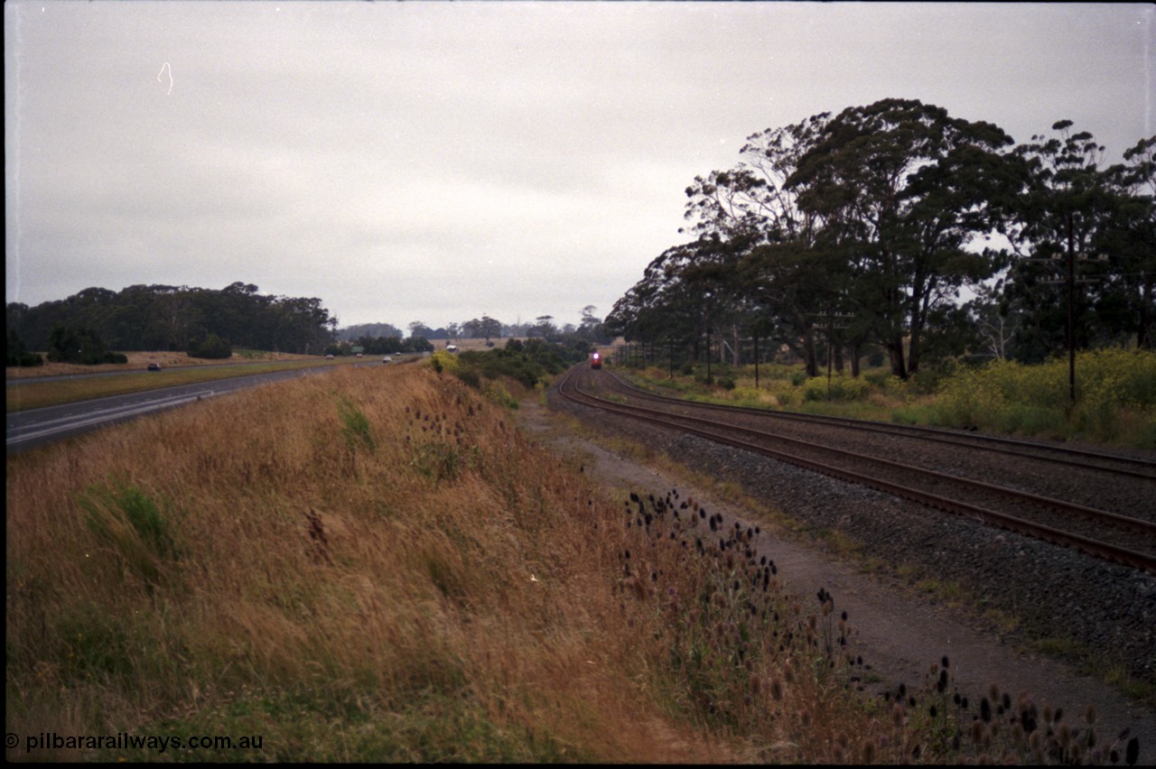 172-10
Bungaree Loop, broad gauge V/Line N class N 453 'City of Albury' a Clyde Engineering EMD model JT22HC-2 serial 85-1221 and N set, Down passenger train.
Keywords: N-class;N453;Clyde-Engineering-Somerton-Victoria;EMD;JT22HC-2;85-1221;