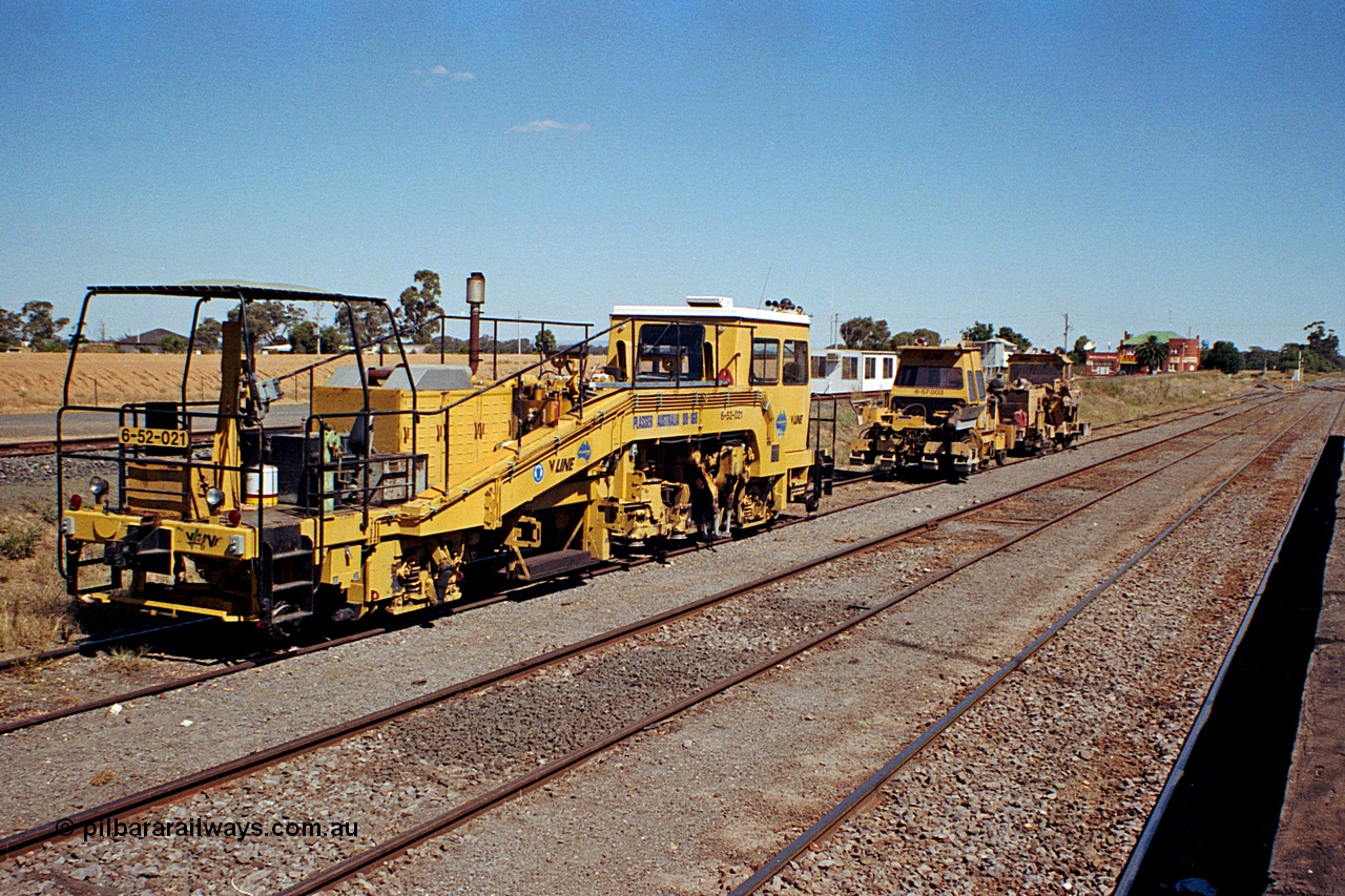 173-07
Murchison East, yard view from station platform looking at V/Line broad gauge track machines, a Plasser track tamper, Tamper sleeper consolidator and a Tamper ballast regulator, the Railway Hotel in the distance.
