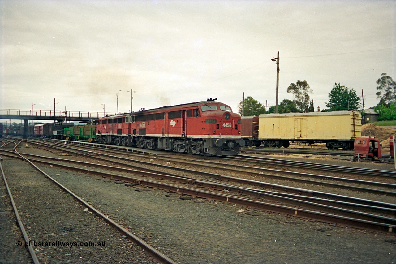 174-23
Albury, yard view from station dock area, NSWSRA standard gauge Red Terror liveried pair of 44 class 4456 AE Goodwin ALCo model DL500B serial 83746 and 4458 AE Goodwin ALCo model DL500B serial 83748 shunt the north with a Melbourne bound goods train.
Keywords: 44-class;4456;AE-Goodwin;ALCo;DL500B;83746;