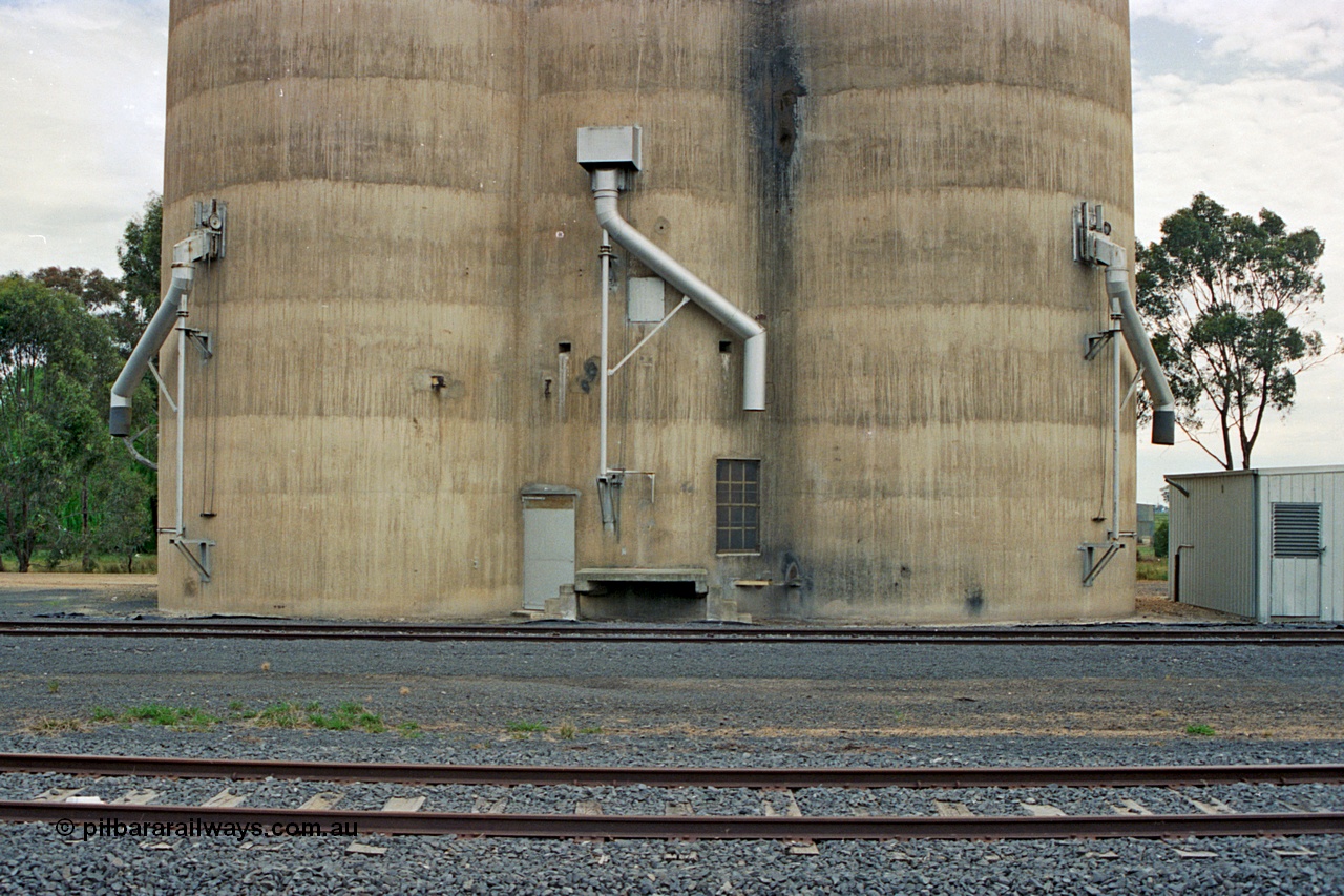 175-19
Pine Lodge, track view looking at load-out spouts on Williamstown style silo complex, staff / storage shed.
