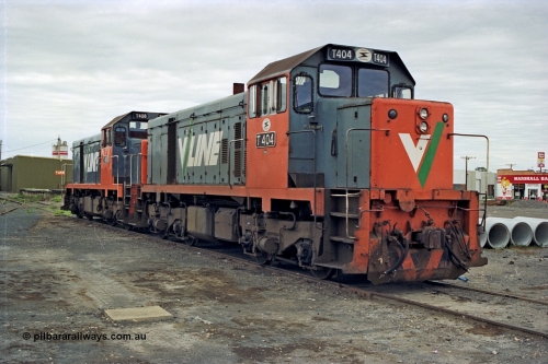 175-01
Shepparton, yard view with V/Line broad gauge T class locomotives T 404 Clyde Engineering EMD model G18B serial 67-499 and T 408 serial 68-624 stabled in the yard.
Keywords: T-class;T404;Clyde-Engineering-Granville-NSW;EMD;G18B;67-499;