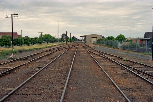 175-10
Shepparton yard overview looking south, at the far left just visible are the points to the Weighbridge Sidings with a cross-over from No.1 to No.2 Roads, start of yard ladder on the right and disused loading shed with canopy in the background.
