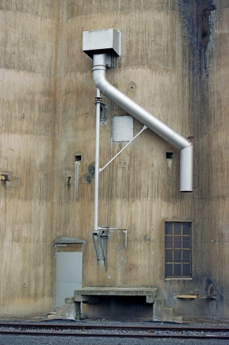 175-18
Pine Lodge, track view looking at load-out spout on Williamstown style silo complex.
