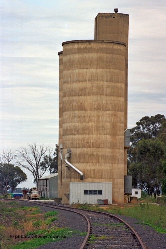 175-21
Pine Lodge, yard view looking towards Shepparton, elevation of Williamstown style silo complex with super phosphate shed beyond it on the right.
