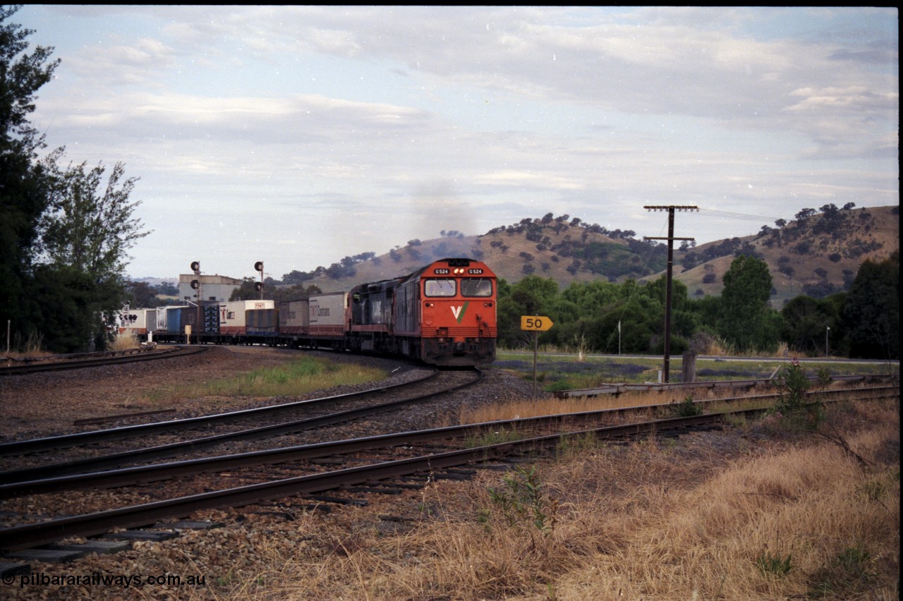 176-12
Wodonga, V/Line standard gauge up goods train passing the Wodonga Coal Sidings behind the G class G 524 Clyde Engineering EMD model JT26C-2SS serial 86-1237 and C class C 505 Clyde Engineering EMD model GT26C serial 76-828 combination, broad gauge track on the left, and the former broad gauge line to Bandiana and Cudgewa curving around to the right.
Keywords: G-class;G524;Clyde-Engineering-Rosewater-SA;EMD;JT26C-2SS;86-1237;