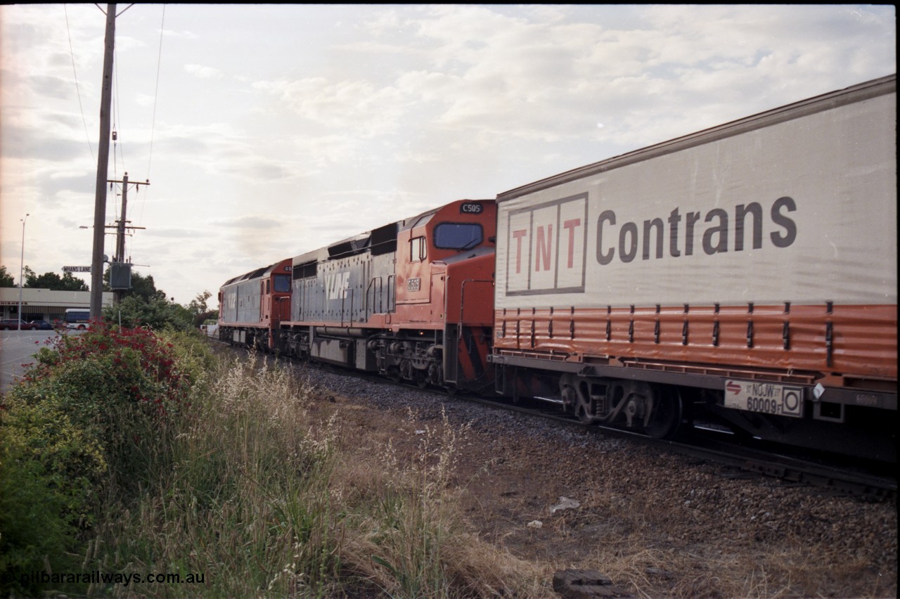 176-14
Wodonga, V/Line standard gauge up goods train behind the G class G 524 Clyde Engineering EMD model JT26C-2SS serial 86-1237 and C class C 505 Clyde Engineering EMD model GT26C serial 76-828 combination at the Bandiana junction, trailing view, train about to cross High Street.
Keywords: C-class;C505;Clyde-Engineering-Rosewater-SA;EMD;GT26C;76-828;