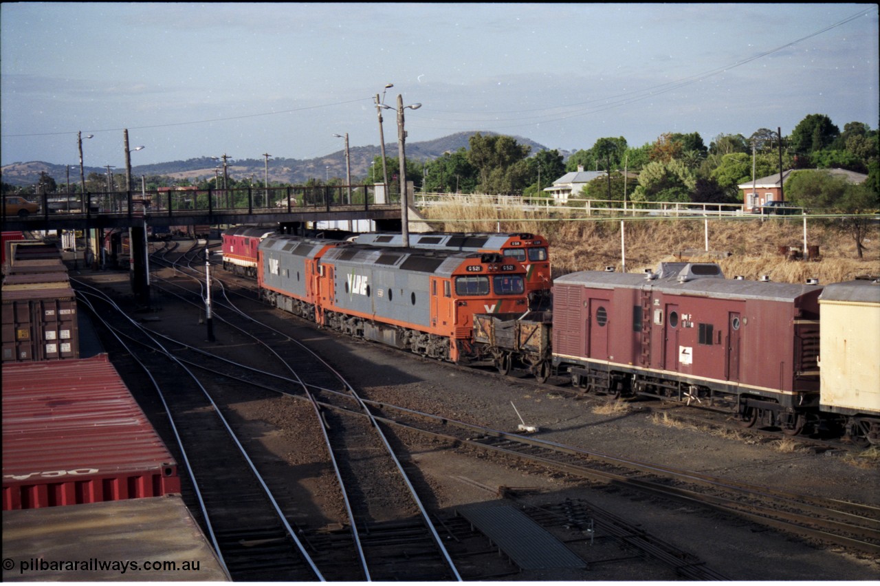 176-15
Albury, yard view looking north from footbridge, three V/Line standard gauge G class locomotives and a couple of NSWSRA 81 class units occupy the loco depot tracks awaiting their next call to duty.
Keywords: G-class;G521;Clyde-Engineering-Rosewater-SA;EMD;JT26C-2SS;85-1234;