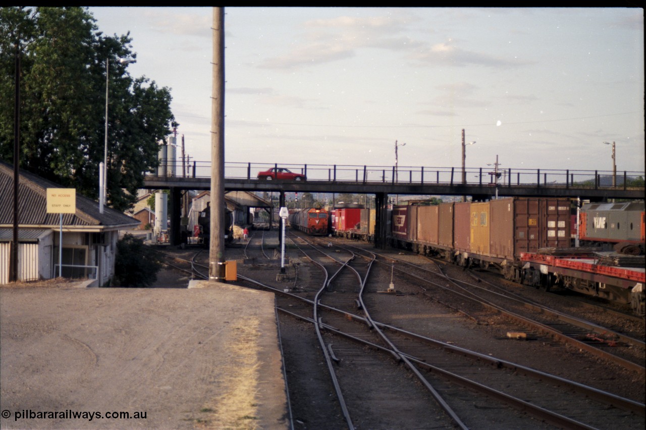 176-17
Albury, a pair of V/Line standard gauge G class units, lead by G 520 Clyde Engineering EMD model JT26C-2SS serial 85-1233 power an up goods train bound for Melbourne towards the platform and a crew change, the broad gauge diamond and track with a tank waggon are visible.
Keywords: G-class;G520;Clyde-Engineering-Rosewater-SA;EMD;JT26C-2SS;85-1233;