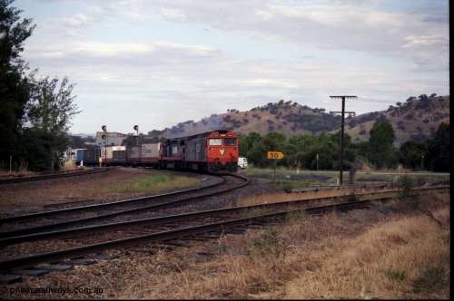 176-10
Wodonga, V/Line standard gauge up goods train passing the Wodonga Coal Sidings behind the G class G 524 Clyde Engineering EMD model JT26C-2SS serial 86-1237 and C class C 505 Clyde Engineering EMD model GT26C serial 76-828 combination, broad gauge track on the left, and the former broad gauge line to Bandiana and Cudgewa curving around to the right.
Keywords: G-class;G524;Clyde-Engineering-Rosewater-SA;EMD;JT26C-2SS;86-1237;