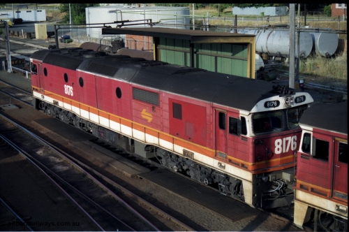 176-16
Albury loco depot fuel point, NSWSRA Candy liveried 81 class 8176 Clyde Engineering EMD model JT26C-2SS serial 85-1095, elevated view from the Dean Street road bridge.
Keywords: 81-class;8176;Clyde-Engineering-Kelso-NSW;EMD;JT26C-2SS;85-1095;