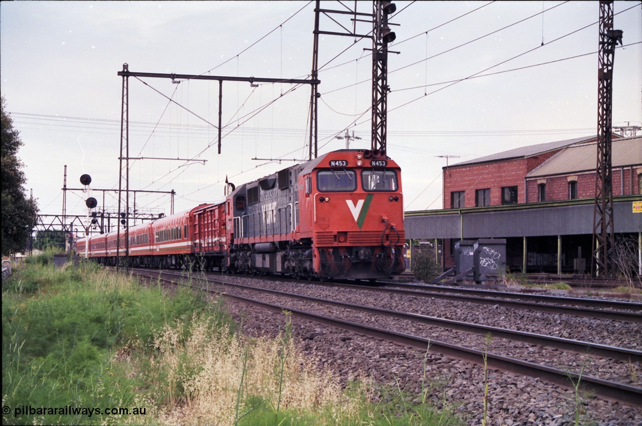 177-05
Newport Junction, V/Line broad gauge N class locomotive N 453 'City of Albury' Clyde Engineering EMD model JT22HC-2 serial 85-1221 leads an up Warrnambool passenger train with D van and 5 car Z set.
Keywords: N-class;N453;Clyde-Engineering-Somerton-Victoria;EMD;JT22HC-2;85-1221;