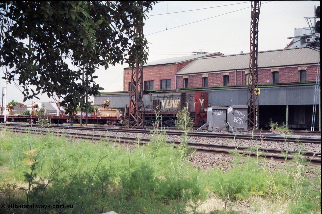 177-07
Newport Junction, V/Line broad gauge shunt locomotive Y class Y 130 Clyde Engineering EMD model G6B serial 65-396 leads a rail recovery train of VZRF class bogie welded rail transport waggons, along the Newport - Sunshine Loop Line in front of the Victorian Oatgrowers Pool Siding.
Keywords: Y-class;Y130;Clyde-Engineering-Granville-NSW;EMD;G6B;65-396;