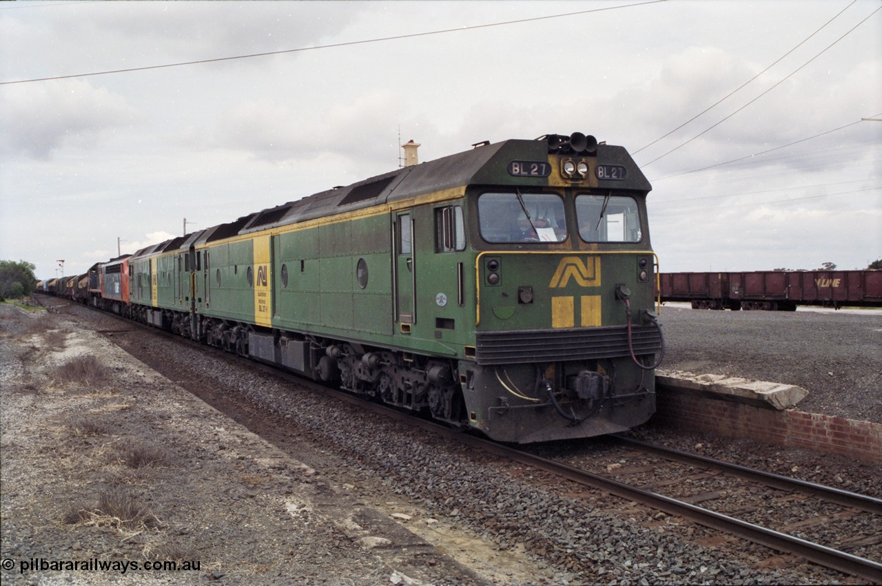 177-19
Gheringhap, down V/Line broad gauge goods train to Adelaide 9169 with the quad power combo of a pair of Australian National BL class locomotives BL 27 Clyde Engineering EMD model JT26C-2SS serial 83-1011 and class leader BL 26 'Bob Hawke' serial 83-1010 and V/Line S class S 313 'Alfred Deakin' Clyde Engineering EMD model A7 serial 61-230 and X class X 53 Clyde Engineering EMD model G26C serial 75-800, BL 27 had Paul Keating drawn on the LHS cab as it was just after he'd taken the Labor Party leadership and the Prime Ministership off Bob Hawke.
Keywords: BL-class;BL27;Clyde-Engineering-Rosewater-SA;EMD;JT26C-2SS;88-1011;