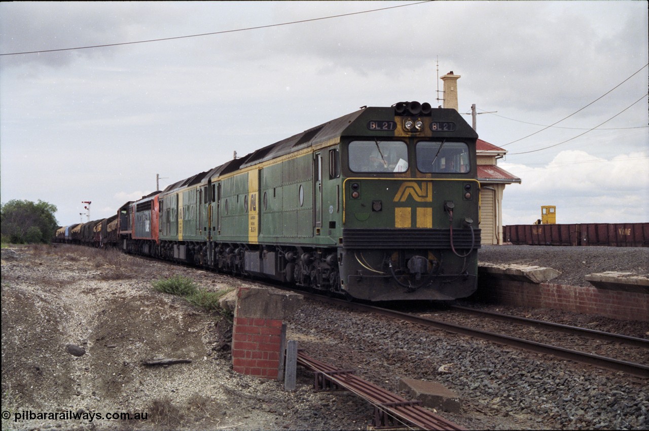 177-20
Gheringhap, down V/Line broad gauge goods train to Adelaide 9169 with the quad power combo of a pair of Australian National BL class locomotives BL 27 Clyde Engineering EMD model JT26C-2SS serial 83-1011 and class leader BL 26 'Bob Hawke' serial 83-1010 and V/Line S class S 313 'Alfred Deakin' Clyde Engineering EMD model A7 serial 61-230 and X class X 53 Clyde Engineering EMD model G26C serial 75-800, BL 27 had Paul Keating drawn on the LHS cab as it was just after he'd taken the Labor Party leadership and the Prime Ministership off Bob Hawke.
Keywords: BL-class;BL27;Clyde-Engineering-Rosewater-SA;EMD;JT26C-2SS;88-1011;