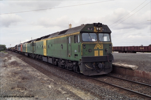 177-19
Gheringhap, down V/Line broad gauge goods train to Adelaide 9169 with the quad power combo of a pair of Australian National BL class locomotives BL 27 Clyde Engineering EMD model JT26C-2SS serial 83-1011 and class leader BL 26 'Bob Hawke' serial 83-1010 and V/Line S class S 313 'Alfred Deakin' Clyde Engineering EMD model A7 serial 61-230 and X class X 53 Clyde Engineering EMD model G26C serial 75-800, BL 27 had Paul Keating drawn on the LHS cab as it was just after he'd taken the Labor Party leadership and the Prime Ministership off Bob Hawke.
Keywords: BL-class;BL27;Clyde-Engineering-Rosewater-SA;EMD;JT26C-2SS;83-1011;
