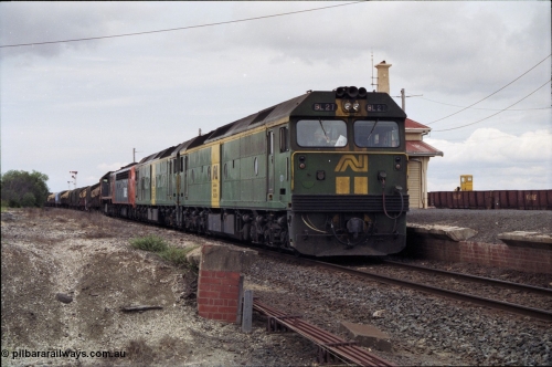 177-20
Gheringhap, down V/Line broad gauge goods train to Adelaide 9169 with the quad power combo of a pair of Australian National BL class locomotives BL 27 Clyde Engineering EMD model JT26C-2SS serial 83-1011 and class leader BL 26 'Bob Hawke' serial 83-1010 and V/Line S class S 313 'Alfred Deakin' Clyde Engineering EMD model A7 serial 61-230 and X class X 53 Clyde Engineering EMD model G26C serial 75-800, BL 27 had Paul Keating drawn on the LHS cab as it was just after he'd taken the Labor Party leadership and the Prime Ministership off Bob Hawke.
Keywords: BL-class;BL27;Clyde-Engineering-Rosewater-SA;EMD;JT26C-2SS;83-1011;
