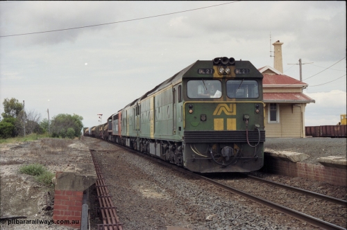 177-22
Gheringhap, down V/Line broad gauge goods train to Adelaide 9169 with the quad power combo of a pair of Australian National BL class locomotives BL 27 Clyde Engineering EMD model JT26C-2SS serial 83-1011 and class leader BL 26 'Bob Hawke' serial 83-1010 and V/Line S class S 313 'Alfred Deakin' Clyde Engineering EMD model A7 serial 61-230 and X class X 53 Clyde Engineering EMD model G26C serial 75-800, BL 27 had Paul Keating drawn on the LHS cab as it was just after he'd taken the Labor Party leadership and the Prime Ministership off Bob Hawke.
Keywords: BL-class;BL27;Clyde-Engineering-Rosewater-SA;EMD;JT26C-2SS;83-1011;