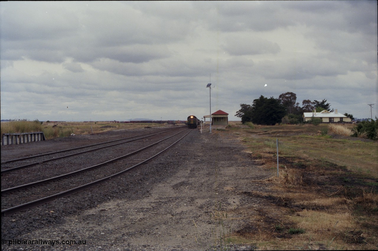 178-01
Cressy, the peace of this once former four way junction station is shattered as V/Line down broad gauge goods train 9169 to Adelaide powers past the station building along the crossing loop behind a quad of screaming EMD 2 stroke locomotives, an Australian National BL class is leading the charge.
