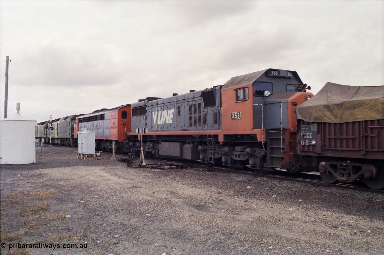 178-05
Cressy, down V/Line broad gauge goods train to Adelaide 9169 powers through the trailable points at the western end of the loop heading towards Ararat, 3rd and 4th units V/Line S class S 313 'Alfred Deakin' Clyde Engineering EMD model A7 serial 61-230 and V/Line X class loco X 53 with serial 75-800 a Clyde Engineering Rosewater SA built EMD model G26C behind Australian National BL class locomotives BL 27 Clyde Engineering EMD model JT26C-2SS serial 83-1011 and class leader BL 26 'Bob Hawke' serial 83-1010.
Keywords: X-class;X53;Clyde-Engineering-Rosewater-SA;EMD;G26C;75-800;