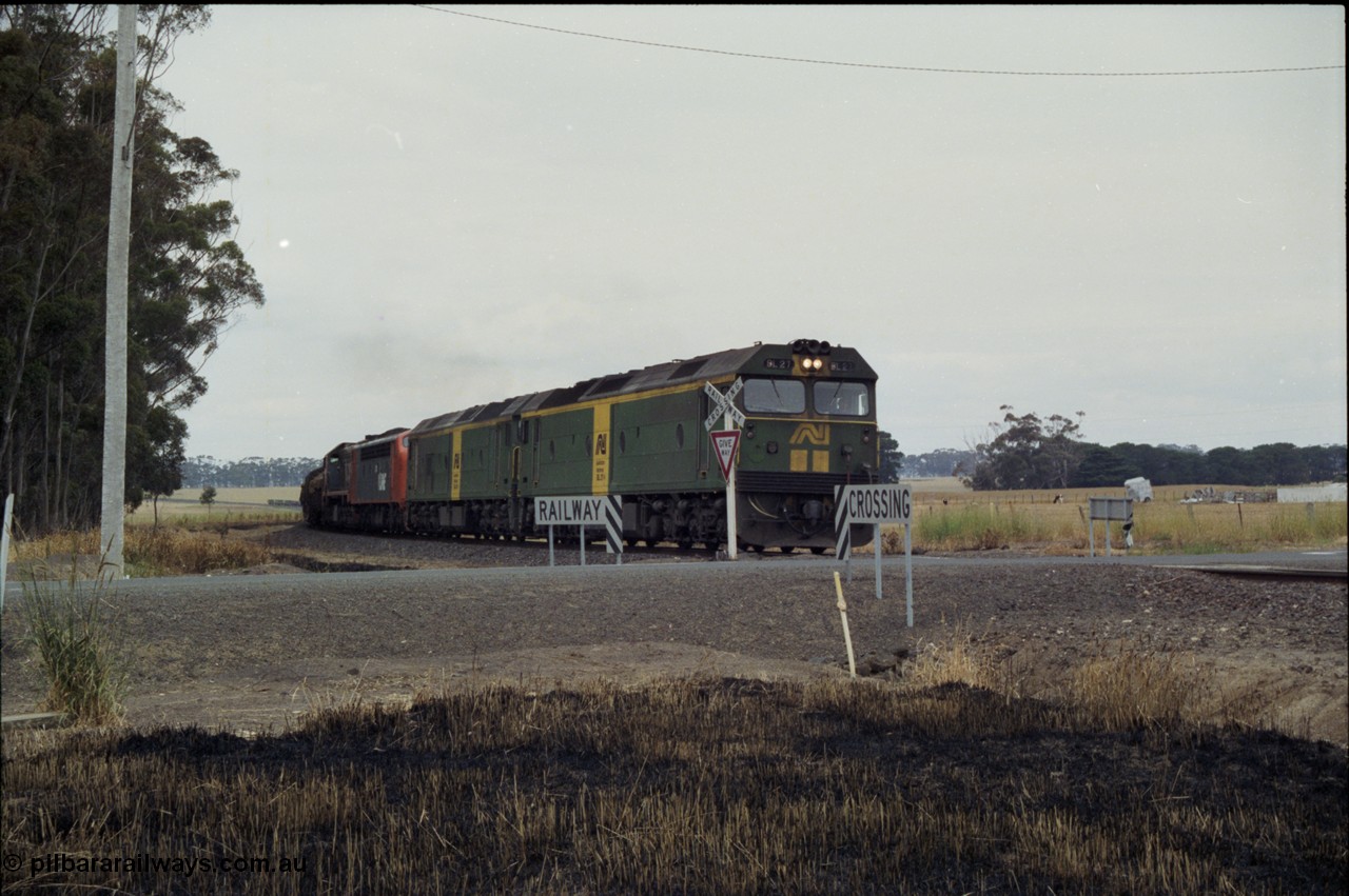 178-06
Lismore, down V/Line broad gauge goods train to Adelaide 9169 runs round the curve as it crosses Gnarpurt Road with the quad combo of a pair of Australian National BL class locomotives BL 27 Clyde Engineering EMD model JT26C-2SS serial 83-1011 and class leader BL 26 'Bob Hawke' serial 83-1010 and V/Line S class S 313 'Alfred Deakin' Clyde Engineering EMD model A7 serial 61-230 and X class X 53 Clyde Engineering EMD model G26C serial 75-800, BL 27 had Paul Keating drawn on the LHS cab as it was just after he'd taken the Labor Party leadership and the Prime Ministership off Bob Hawke.
Keywords: BL-class;BL27;Clyde-Engineering-Rosewater-SA;EMD;JT26C-2SS;83-1011;