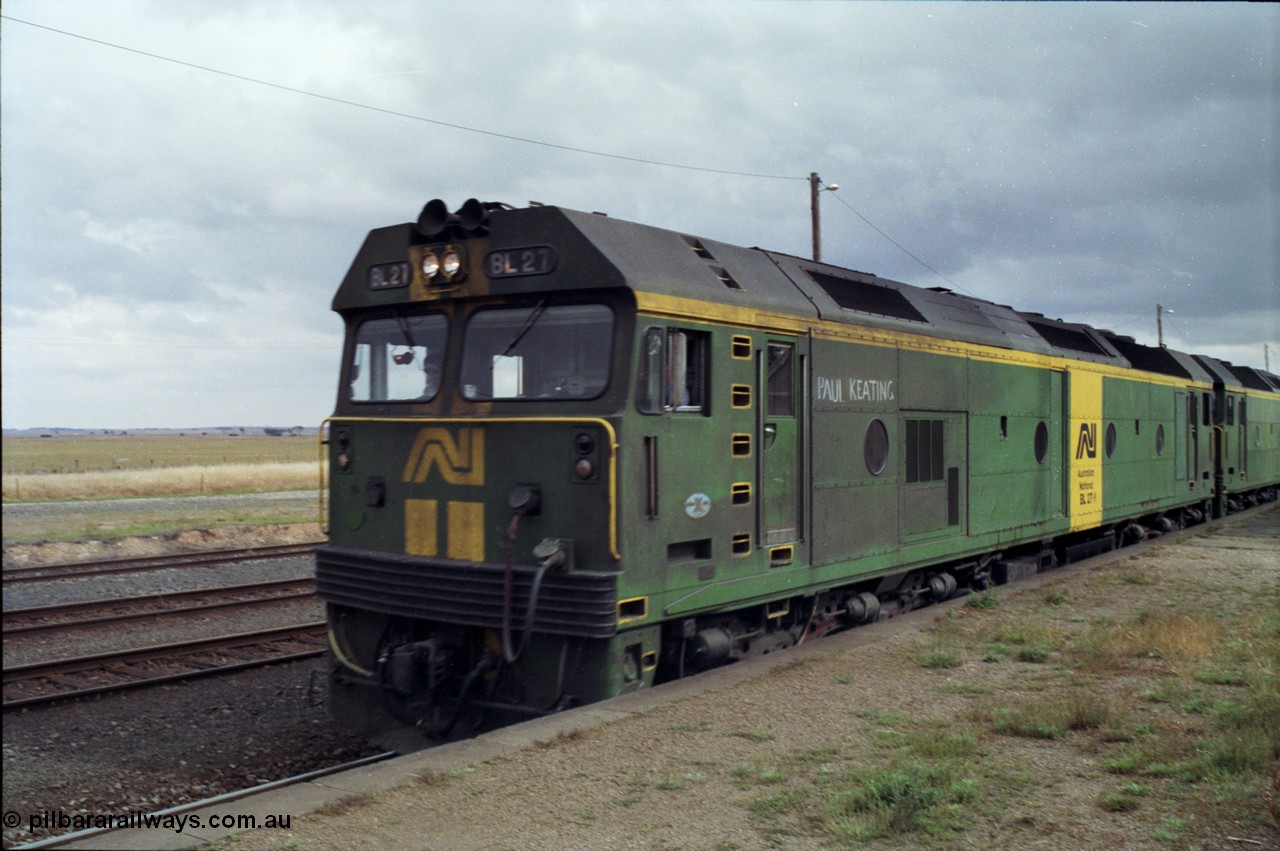 178-13
Maroona, station platform, Australian National BL class locomotive BL 27 Clyde Engineering EMD model JT26C-2SS serial 83-1011 with Paul Keating chalked on runs along the platform with V/Line's broad gauge down goods train to Adelaide, 9169.
Keywords: BL-class;BL27;Clyde-Engineering-Rosewater-SA;EMD;JT26C-2SS;88-1011;