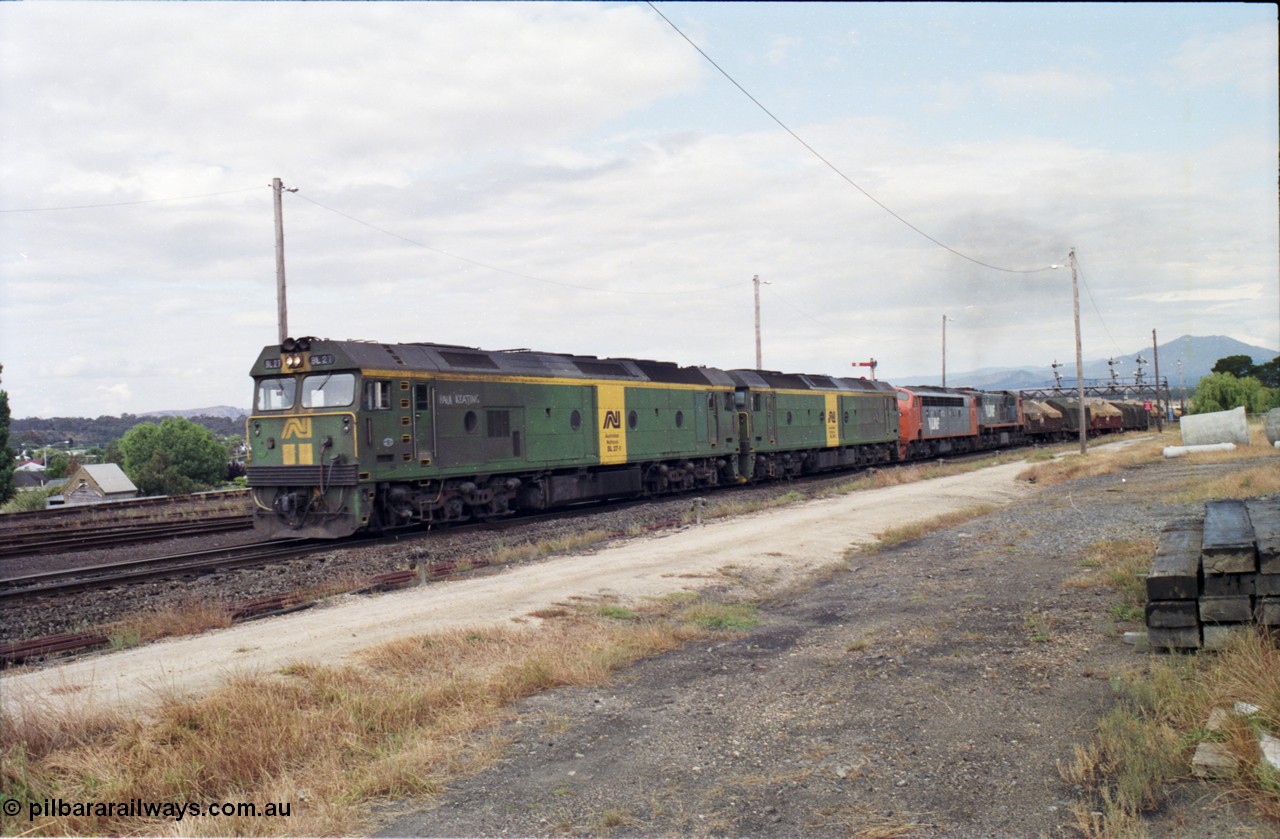 178-17
Ararat, track view looking east as V/Line broad gauge goods train 9169 to Adelaide runs along the mainline off the Portland line behind Australian National BL class locomotives BL 27 Clyde Engineering EMD model JT26C-2SS serial 83-1011 and class leader BL 26 'Bob Hawke' serial 83-1010 and V/Line S class S 313 'Alfred Deakin' Clyde Engineering EMD model A7 serial 61-230 and X class X 53 Clyde Engineering EMD model G26C serial 75-800, taken from the former Works and Cattle Sidings area, BL 27 had Paul Keating drawn on the LHS cab as it was just after he'd taken the Labor Party leadership and the Prime Ministership off Bob Hawke.
Keywords: BL-class;BL27;Clyde-Engineering-Rosewater-SA;EMD;JT26C-2SS;88-1011;