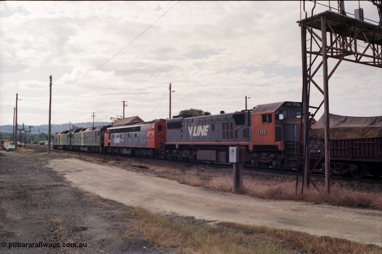 178-18
Ararat, track view looking west as V/Line broad gauge goods train 9169 to Adelaide runs along the mainline behind Australian National BL class locomotives BL 27 Clyde Engineering EMD model JT26C-2SS serial 83-1011 and class leader BL 26 'Bob Hawke' serial 83-1010 and V/Line S class S 313 'Alfred Deakin' Clyde Engineering EMD model A7 serial 61-230 and V/Line X class loco X 53 with serial 75-800 a Clyde Engineering Rosewater SA built EMD model G26C, taken from the former Works and Cattle Sidings area, Ararat A Signal Box roof is visible over the S class.
Keywords: X-class;X53;Clyde-Engineering-Rosewater-SA;EMD;G26C;75-800;