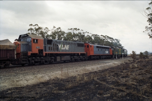 178-07
Lismore, V/Line broad gauge 9169 goods train to Adelaide powers into the loop heading for Ararat with the quad combo of a pair of Australian National BL class locomotives BL 27 Clyde Engineering EMD model JT26C-2SS serial 83-1011 and class leader BL 26 'Bob Hawke' serial 83-1010 and V/Line S class S 313 'Alfred Deakin' Clyde Engineering EMD model A7 serial 61-230 and V/Line X class loco X 53 with serial 75-800 a Clyde Engineering Rosewater SA built EMD model G26C.
Keywords: X-class;X53;Clyde-Engineering-Rosewater-SA;EMD;G26C;75-800;