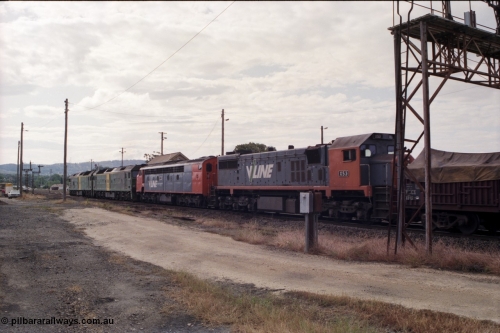 178-18
Ararat, track view looking west as V/Line broad gauge goods train 9169 to Adelaide runs along the mainline behind Australian National BL class locomotives BL 27 Clyde Engineering EMD model JT26C-2SS serial 83-1011 and class leader BL 26 'Bob Hawke' serial 83-1010 and V/Line S class S 313 'Alfred Deakin' Clyde Engineering EMD model A7 serial 61-230 and V/Line X class loco X 53 with serial 75-800 a Clyde Engineering Rosewater SA built EMD model G26C, taken from the former Works and Cattle Sidings area, Ararat A Signal Box roof is visible over the S class.
Keywords: X-class;X53;Clyde-Engineering-Rosewater-SA;EMD;G26C;75-800;