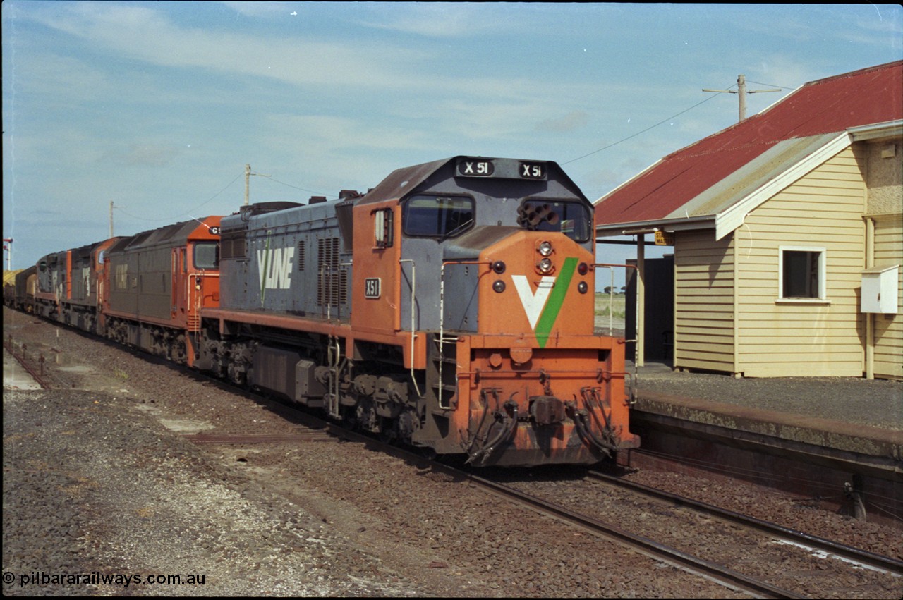 179-12
Gheringhap, V/Line broad gauge X class locomotive X 51 Clyde Engineering EMD model G26C serial 75-798 leads an impressive quad lash-up with G class G 512 Clyde Engineering EMD model JT26C-2SS serial 84-1240 and C classes C 510 Clyde Engineering EMD model GT26C serial 76-833 and C 509 serial 76-832 as they come to a stand at the platform with train number 9169 down goods to Adelaide.
Keywords: X-class;X51;Clyde-Engineering-Rosewater-SA;EMD;G26C;75-798;