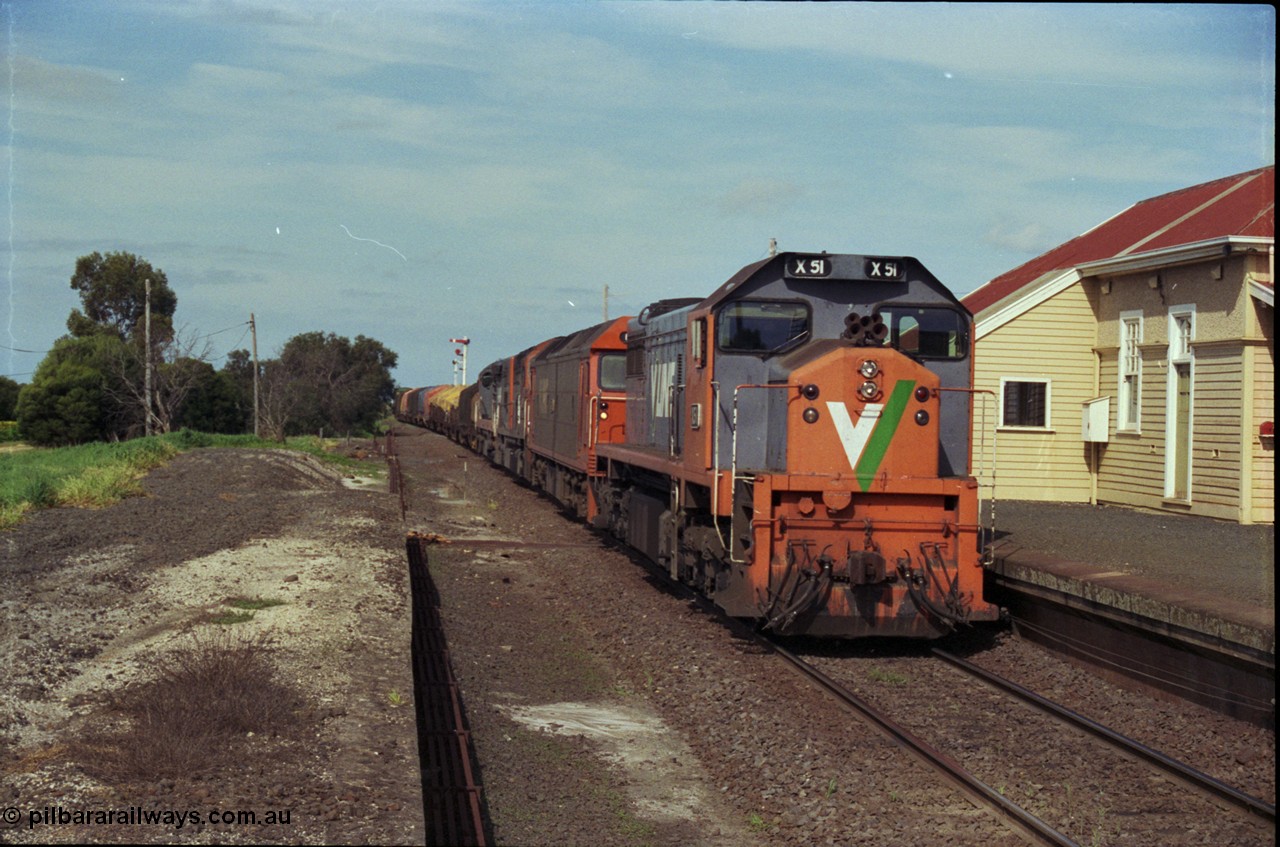 179-13
Gheringhap, V/Line broad gauge X class locomotive X 51 Clyde Engineering EMD model G26C serial 75-798 leads an impressive quad lash-up with G class G 512 Clyde Engineering EMD model JT26C-2SS serial 84-1240 and C classes C 510 Clyde Engineering EMD model GT26C serial 76-833 and C 509 serial 76-832 as they stand at the platform with train number 9169 down goods to Adelaide.
Keywords: X-class;X51;Clyde-Engineering-Rosewater-SA;EMD;G26C;75-798;