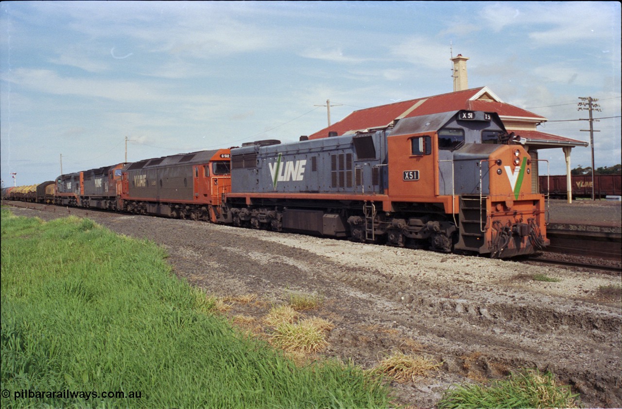 179-14
Gheringhap, V/Line broad gauge X class locomotive X 51 Clyde Engineering EMD model G26C serial 75-798 leads an impressive quad lash-up with G class G 512 Clyde Engineering EMD model JT26C-2SS serial 84-1240 and C classes C 510 Clyde Engineering EMD model GT26C serial 76-833 and C 509 serial 76-832 as they stand at the platform with train number 9169 down goods to Adelaide.
Keywords: X-class;X51;Clyde-Engineering-Rosewater-SA;EMD;G26C;75-798;