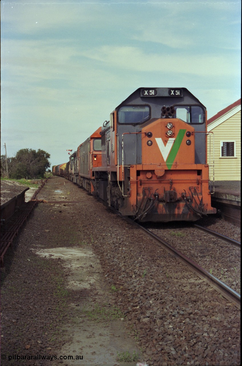 179-15
Gheringhap, V/Line broad gauge X class locomotive X 51 Clyde Engineering EMD model G26C serial 75-798 leads an impressive quad lash-up with G class G 512 Clyde Engineering EMD model JT26C-2SS serial 84-1240 and C classes C 510 Clyde Engineering EMD model GT26C serial 76-833 and C 509 serial 76-832 as they stand at the platform with train number 9169 down goods to Adelaide.
Keywords: X-class;X51;Clyde-Engineering-Rosewater-SA;EMD;G26C;75-798;