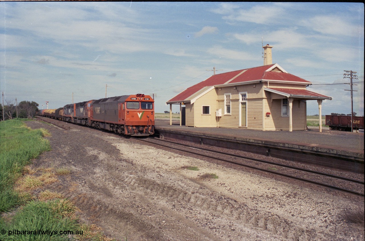 179-17
Gheringhap station overview with V/Line broad gauge goods train 9169 to Adelaide behind G class G 512 Clyde Engineering EMD model JT26C-2SS serial 84-1240 and C classes C 510 Clyde Engineering EMD model GT26C serial 76-833 and C 509 serial 76-832 as they stand at the platform awaiting a train order to continue on towards Ararat on the Maroona line.
Keywords: G-class;G512;Clyde-Engineering-Rosewater-SA;EMD;JT26C-2SS;84-1240;