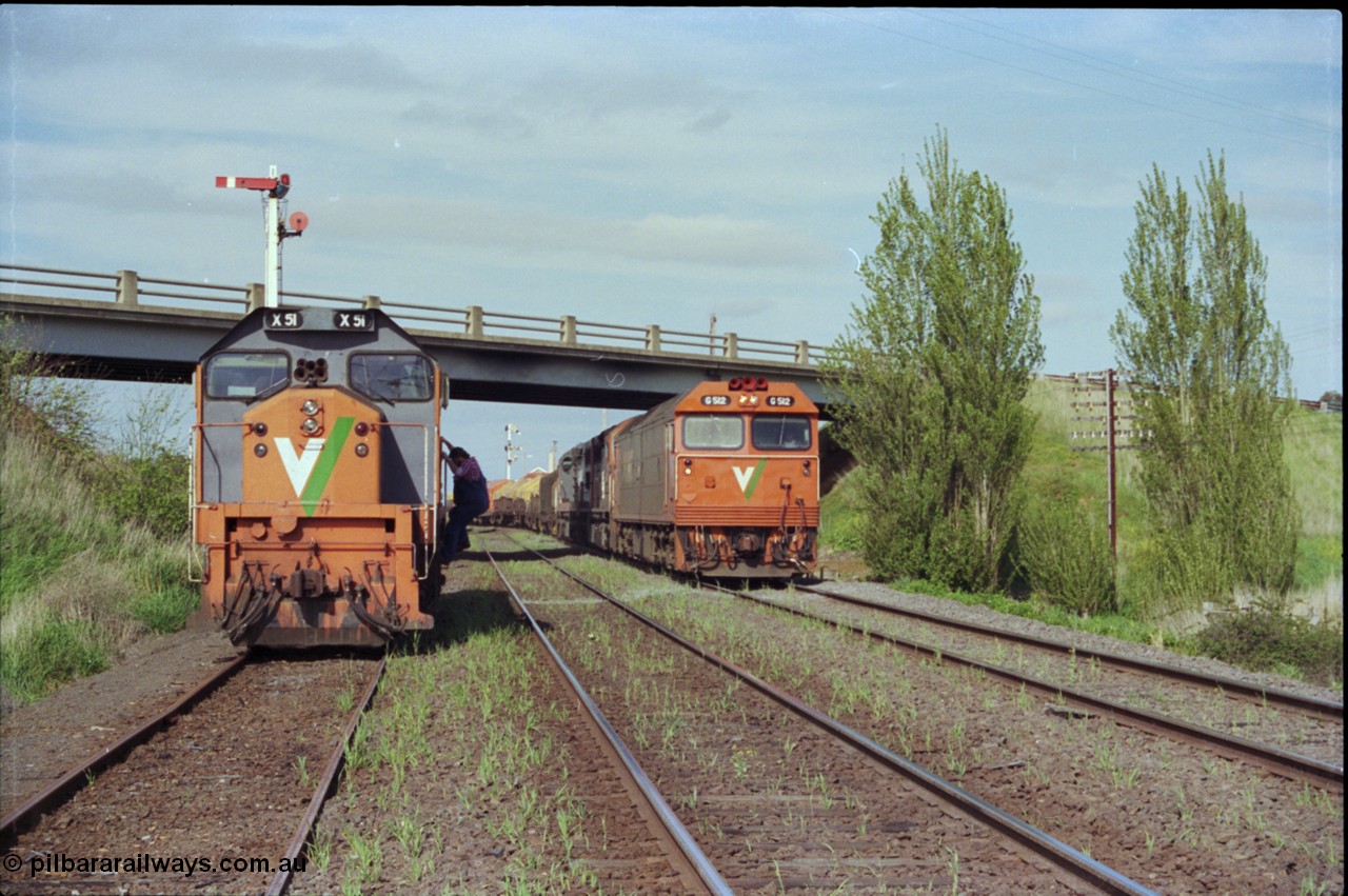 179-23
Gheringhap, V/Line broad gauge goods train 9169 to Adelaide behind G class G 512 Clyde Engineering EMD model JT26C-2SS serial 84-1240 and C classes C 510 Clyde Engineering EMD model GT26C serial 76-833 and C 509 serial 76-832 creeps along the Maroona Line under the Midland Highway overpass as the 2nd person climbs out of X class X 51 Clyde Engineering EMD model G26C serial 75-798 to make his way back onto G 512 and head home to Dimboola.
Keywords: X-class;X51;Clyde-Engineering-Rosewater-SA;EMD;G26C;75-798;