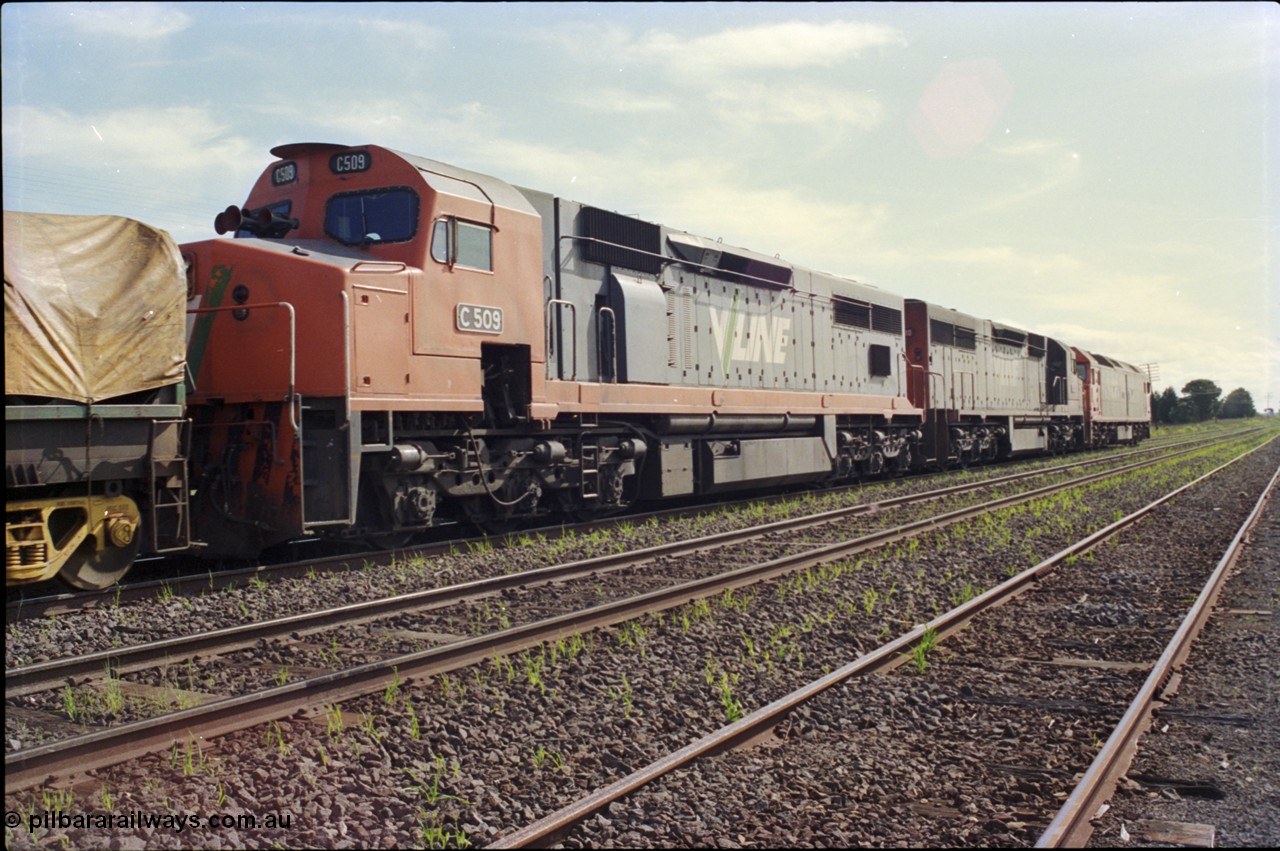 179-26
Gheringhap, trailing view of V/Line broad gauge goods train 9169 to Adelaide behind G class G 512 Clyde Engineering EMD model JT26C-2SS serial 84-1240 and C classes C 510 Clyde Engineering EMD model GT26C serial 76-833 and C 509 serial 76-832, the line in the middle is the Ballarat Line and then closest to camera is Siding C.
Keywords: C-class;C509;Clyde-Engineering-Rosewater-SA;EMD;GT26C;76-832;