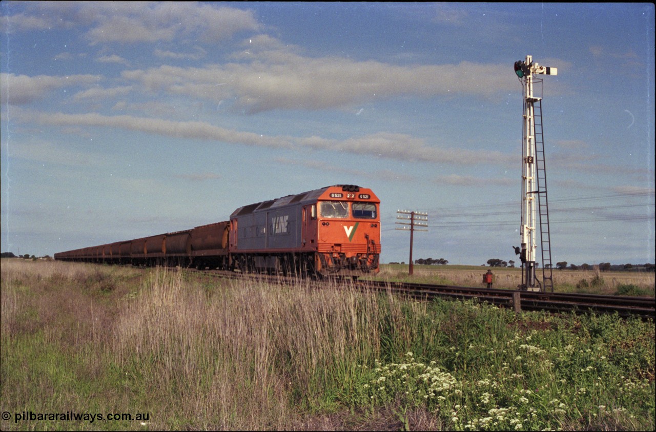 179-35
Gheringhap, track view looking east back towards Geelong with V/Line broad gauge G class G 521 Clyde Engineering EMD model JT26C-2SS serial 85-1234 locked away with down empty grain train 9121 consisting of 26 bogie grain waggons in Siding A, semaphore signal post 2 is the down home for the mainline.
Keywords: G-class;G521;Clyde-Engineering-Rosewater-SA;EMD;JT26C-2SS;85-1234;