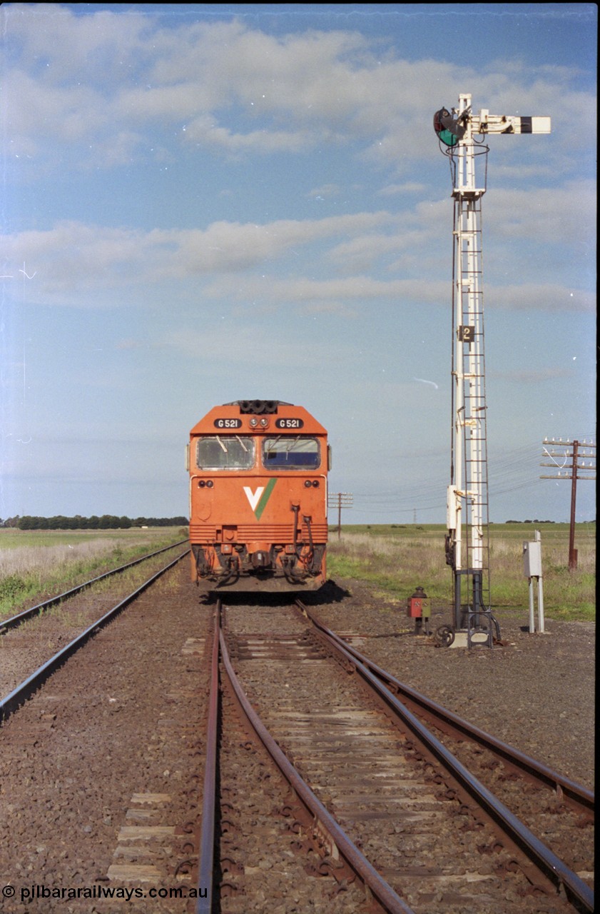 179-36
Gheringhap, track view looking east back towards Geelong with V/Line broad gauge G class G 521 Clyde Engineering EMD model JT26C-2SS serial 85-1234 locked away with down empty grain train 9121 in Siding A, semaphore signal post 2 is the down home for the mainline, the points and point indicator are set for in the reverse for Siding B.
Keywords: G-class;G521;Clyde-Engineering-Rosewater-SA;EMD;JT26C-2SS;85-1234;