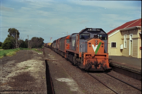 179-13
Gheringhap, V/Line broad gauge X class locomotive X 51 Clyde Engineering EMD model G26C serial 75-798 leads an impressive quad lash-up with G class G 512 Clyde Engineering EMD model JT26C-2SS serial 84-1240 and C classes C 510 Clyde Engineering EMD model GT26C serial 76-833 and C 509 serial 76-832 as they stand at the platform with train number 9169 down goods to Adelaide.
Keywords: X-class;X51;Clyde-Engineering-Rosewater-SA;EMD;G26C;75-798;