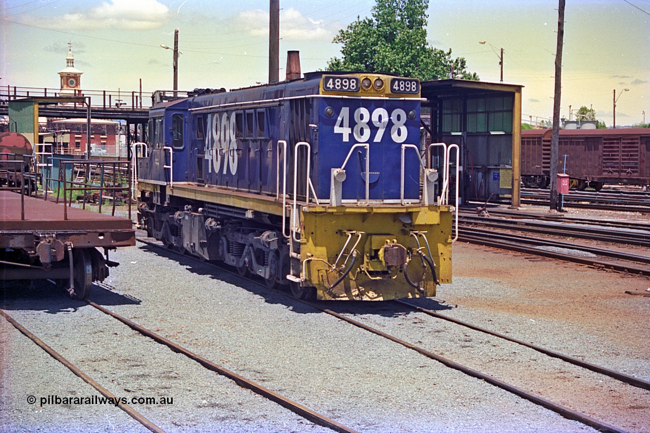 180-18
Albury, NSW, loco depot, NSWSRA standard gauge 48 class locomotive 4898 AE Goodwin ALCo model DL531 serial G3420-13 wearing Freight Rail livery rests near the fuel points.
Keywords: 48-class;4898;AE-Goodwin;ALCo;DL531;G3420-13;