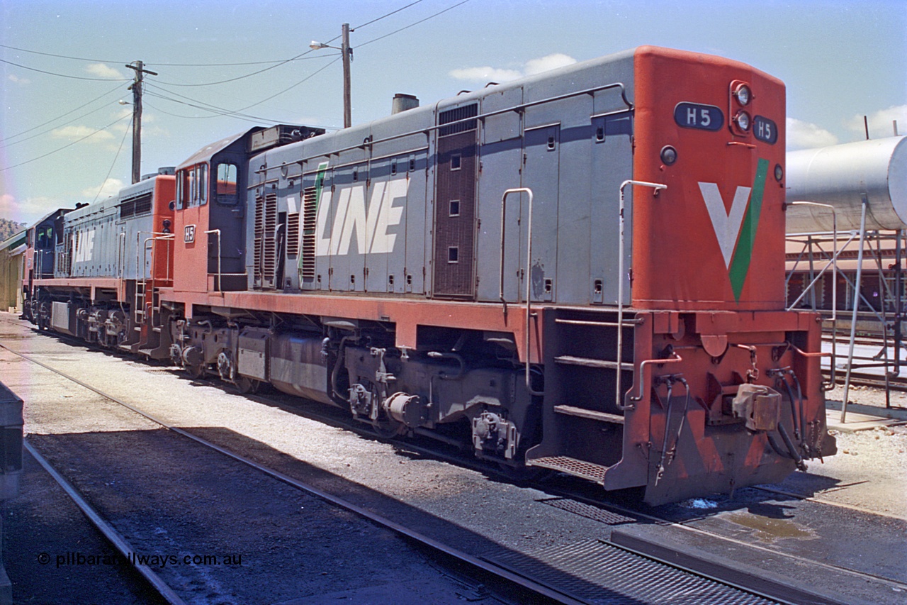 180-26
Wodonga loco depot fuel point, V/Line broad gauge H class H 5 Clyde Engineering EMD model G18B serial 68-632 and X class X 34 Clyde Engineering EMD model G16C serial 66-487 wait to run the Sunday evening up Albury slab steel train.
Keywords: H-class;H5;Clyde-Engineering-Granville-NSW;EMD;G18B;68-632;