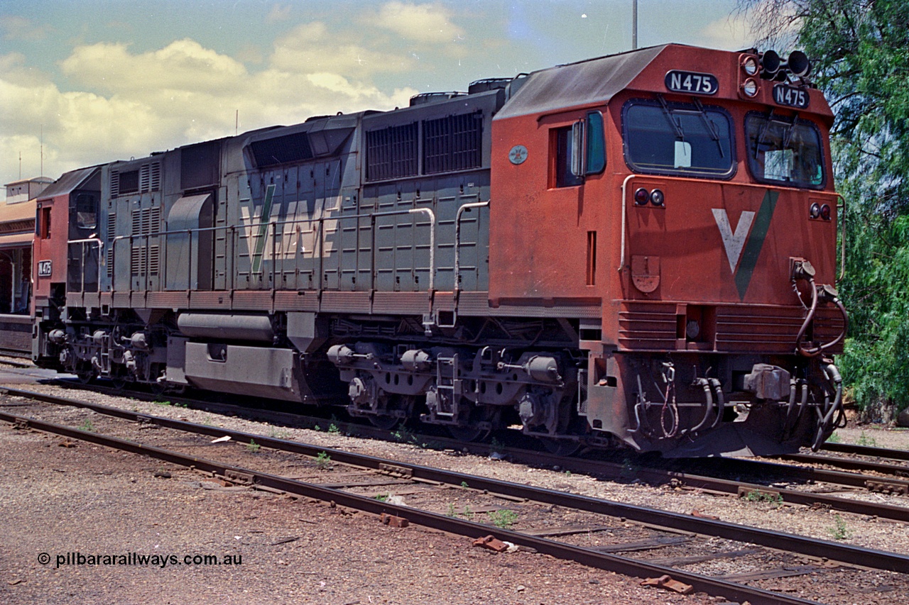 180-36
Wodonga, the last member of V/Line broad gauge N class locomotives N 475 'City of Moe' Clyde Engineering EMD model JT22HC-2 serial 87-1204 stands near the signal box shut down having bought the morning down passenger service from Melbourne.
Keywords: N-class;N475;Clyde-Engineering-Somerton-Victoria;EMD;JT22HC-2;87-1204;