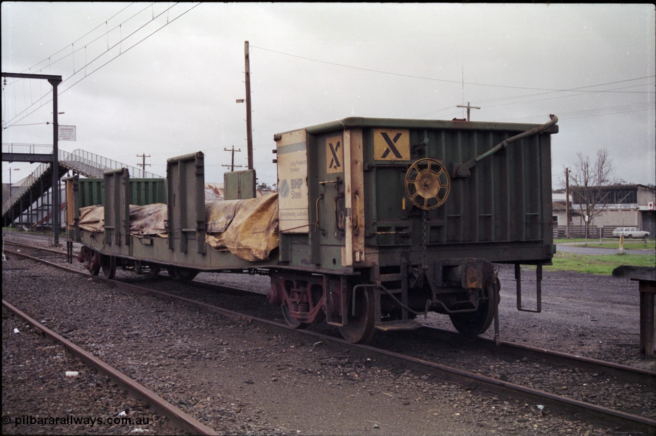 181-08
Trafalgar yard, loaded Australian National AKFX type bogie steel waggon AKFX 12, in AN green and yellow livery, BHP Steel Long Products Division plate, hand brake end.
Keywords: AKFX-type;AKFX12;